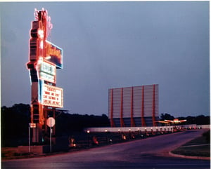 screen tower, box office, and neon marquee