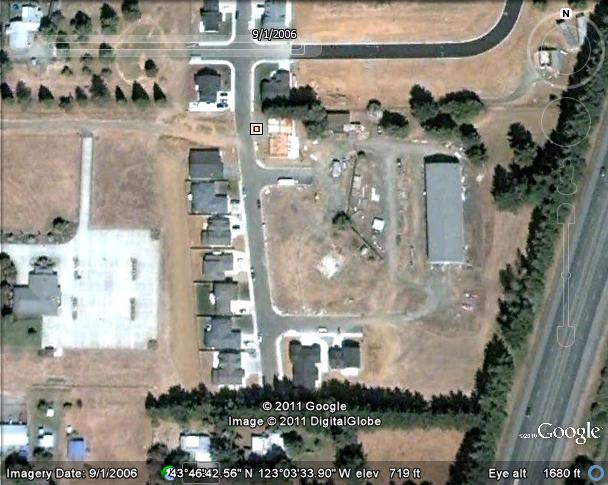 Recent Google photo of the former site of the Corral Drive-In in Cottage Grove, Oregon. Note some of the original structure still remains.
