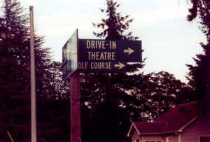 Sign pointing to way to the drive-in