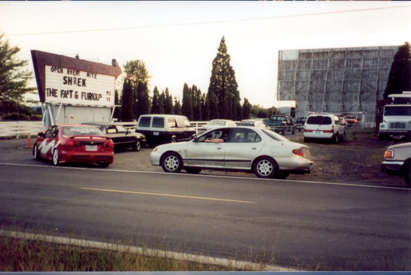 Cars line up in front of the marquee to enter