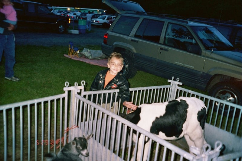 Tyler enjoying the petting zoo at BECKY's Drive-In