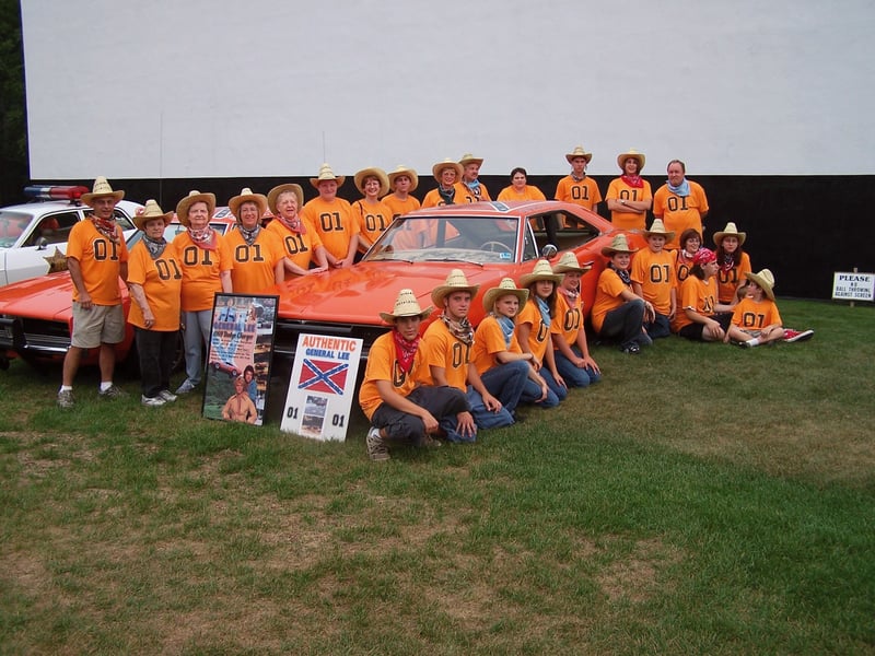employees dress up for the Dukes of Hazard movie with General Lee