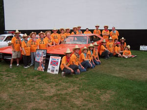 employees dress up for the Dukes of Hazard movie with General Lee