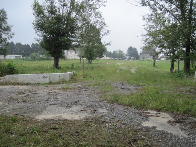 Front of field, looking towards exit. Screen was behind and to left of low wall in foreground.