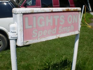lights on sign at entrance