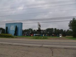 Corry Drive-In, Screen Tower, Sign, Ticket Booth and Cartoon Characters as viewed from across the road.