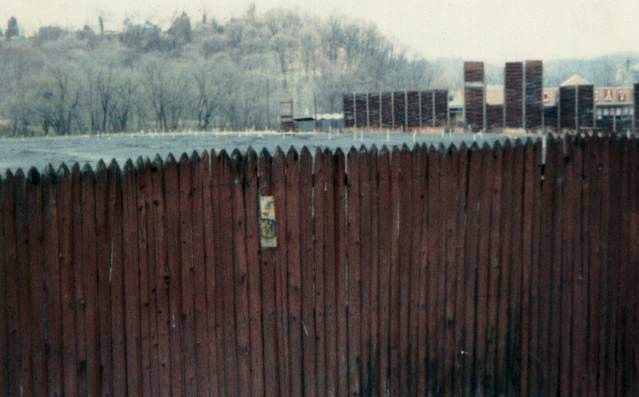 Drive-in lot with speaker poles, box office in background (The screens were already torn down at this point)