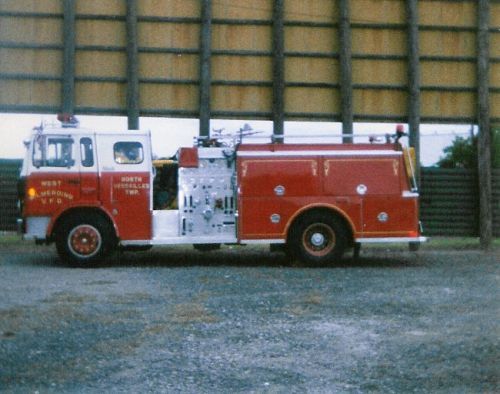 A West Wilmerding Fire Truck parked behind Screen 5 at a car cruise