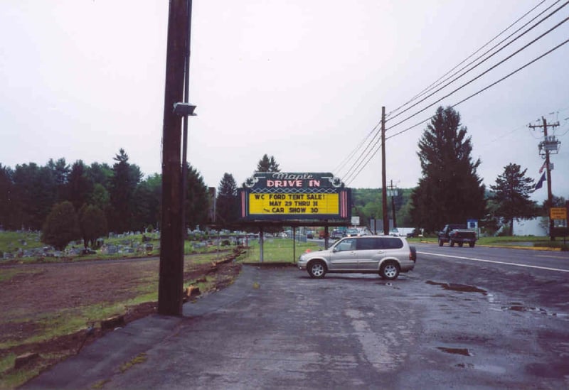 Another view of the Marquee. The natural tree barrier and the short wooden fence separating the Maple's entrance road from the last parking road of the theater have been removed.