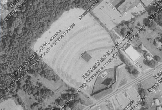 There is currently a strip mall with a sushi restaurant here.  However, if you drive around the back you can see a field that is part of the original drive-in grounds.