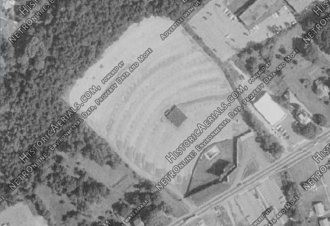 There is currently a strip mall with a sushi restaurant here. However, if you drive around the back you can see a field that is part of the original drive-in grounds.