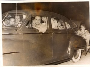 This picture taken at the Nu-Way Drive In entrance in the early 1950's.  It was the first night that "$1 a carload" was offered.  The car is a 1948 Chrysler.  The driver is Walter C.Good of Island Park, Northumberland.  There are 35 people in the car.  Th