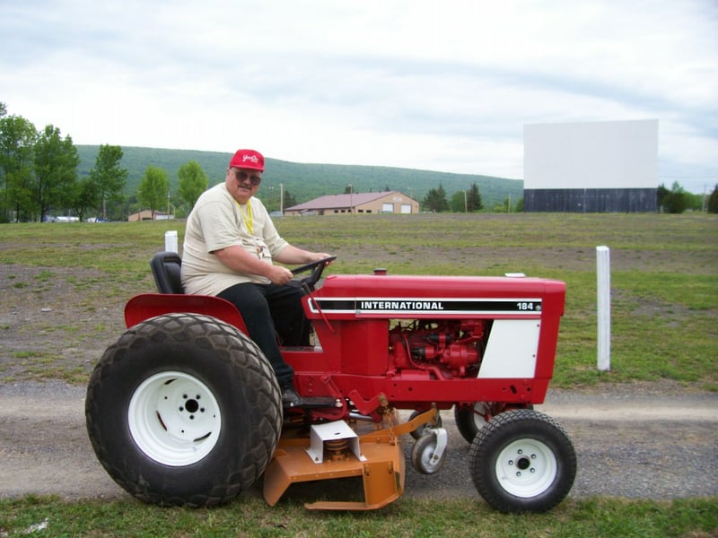 Crazy Bob, on his tractor, getting ready to mow the Pike's 11 acres.