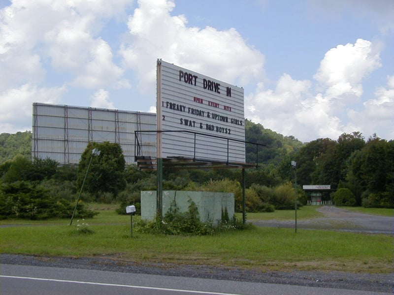 The front entrance, sign, and 0ne screen