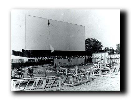 This is a photo taken  of the spotlight 88 drive-in theater,the screen and carnival style play ground with roller coaster, merry-go -round,Train and flying saucers not in picture,Mr. Felton,also had a mini hook and ladder Fire truck,with a Nash rambler ca