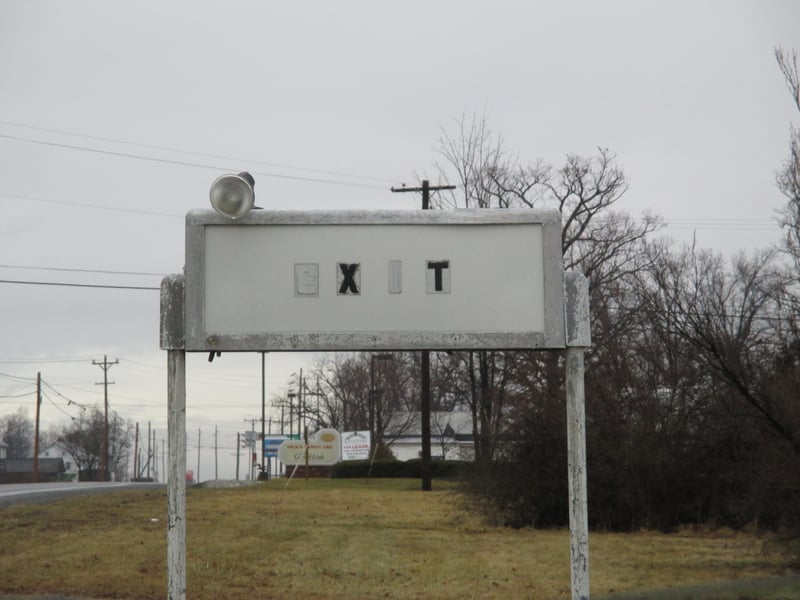 The old exit sign. The sign for the enterence now reads additional parking for a home improvement store across the street