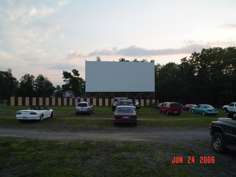 This is my '89 Eagle Premier parked in front of the screen. It was its final night with me at a drive-in. The engine was overheating, but I made it back to Ohio.