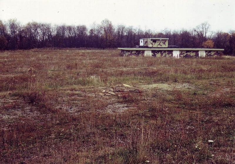 The empty field with only the projection/concession building still standing