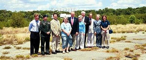 a meeting of officials at the site of the drive-in right before signing a bill that will turn it into a wildlife preserve.