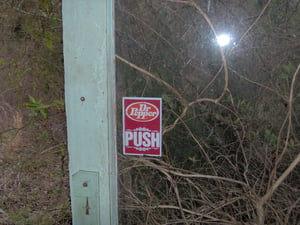 dr.pepper sign still on the door at entrance too concession stand.