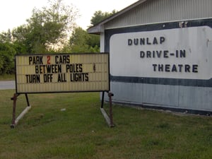 sign on the front of the ticket booth.