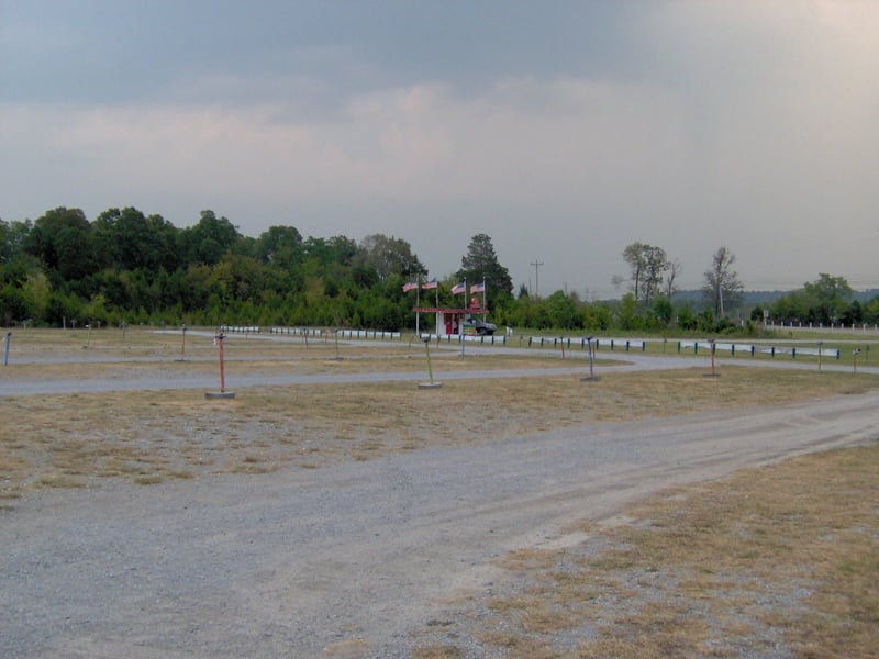 speaker poles with ticket booth in the back ground