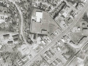 MSN TerraServer image. The big parking lot next to the white roofed building is where the drive-in used to be. The old tree line of the drive-in still exists on the bottom and left of the site.