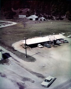 A slight glimpse of the Midway sign on the far left with part of the lot toward the top of the picture.