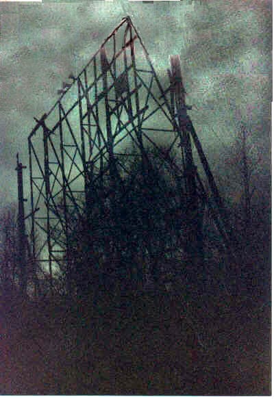 The sad screen skeleton with an eerie greenish stormy sky as a backdrop.