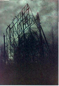 The sad screen skeleton with an eerie greenish stormy sky as a backdrop.