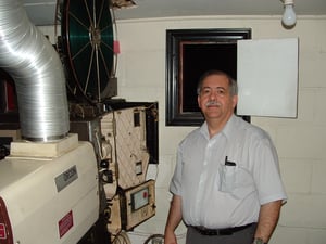 Gene Estep at one of the Stateline's vintage Brenkert projectors.