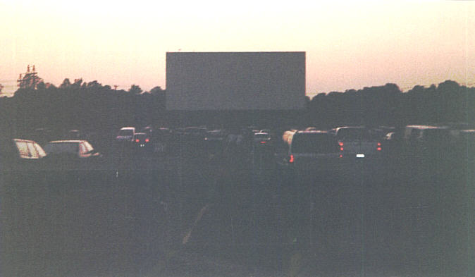 Cars waiting for the show to begin at the Summer, around sunset.