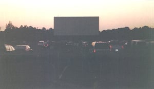 Cars waiting for the show to begin at the Summer, around sunset.