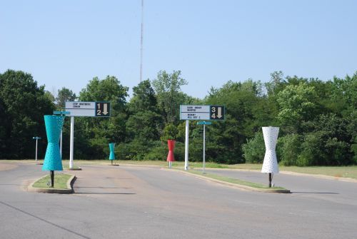 The entrance road with googie style lightposts.