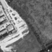 This is an airal view of the location of this old Drive In shot in 1995. It is now empty space occupied by an old Flea Market.