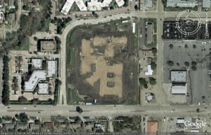 Aerial view showing the former drive-in site still undeveloped