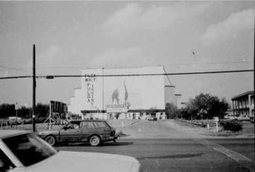 distant shot of bull mural/screen tower in the distance, + the entranceway