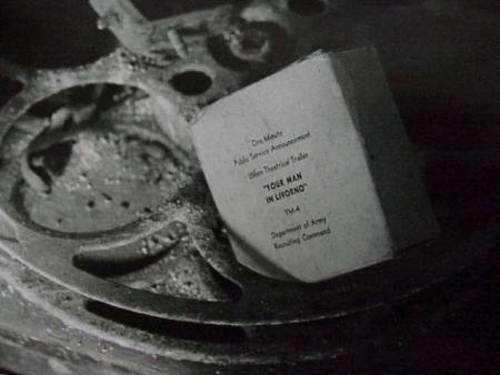 old film box that used to contain a one minute public service announcement film from the "Department of the Army, Recruiting Command" "Your Man in Livorno"
