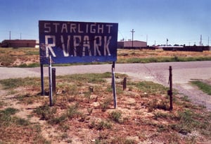 Former Starlight RV Park`s entrance road leading across the Drive-In field