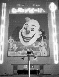 Famous clown face on the screen tower of the Chalk Hill Drive-In.