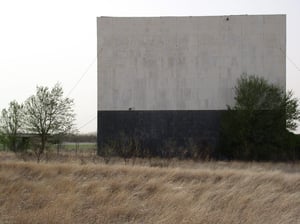 Front of the Screen and Box Office. Behind the trees..