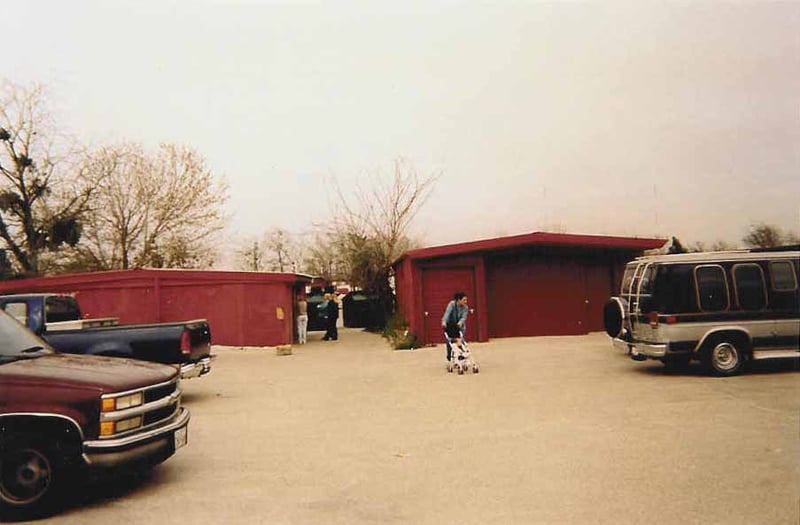 The building on the left is the restrooms (which is still used by the flea market patrons) and the projection booth. On the right is the old concession building.