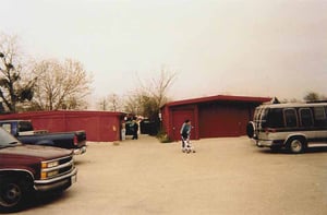 The building on the left is the restrooms (which is still used by the flea market patrons) and the projection booth. On the right is the old concession building.