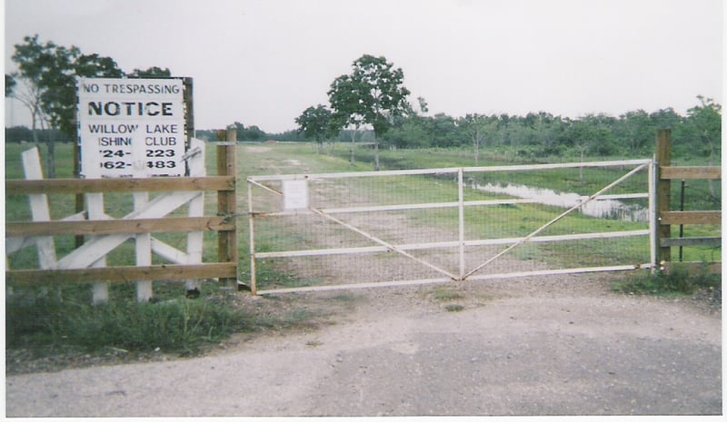 The road that was the entrance of the Don Drive-In Theatre. As the sign says, it's now a private fishing club.