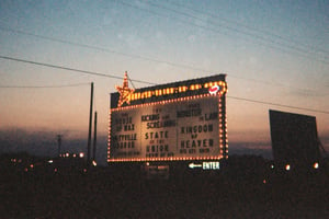 marquee at sundown with screen in background