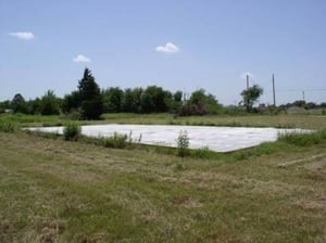 Another shot of The Screen as it lays face down in the field across the street from where it used to stand.
