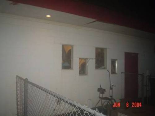 Looking through the portholes of the projection booth. Notice the dual-projector setup with the hour-long reels.