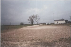 This is a side exit. The sign says that the building on the right is a church.