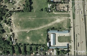 Aerial view of former drive-in site before the housing complex has been constructed