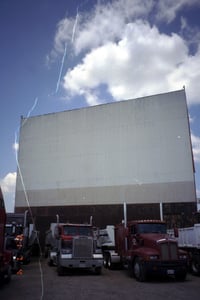 view of screen (and trucks using  DI as parking facility)